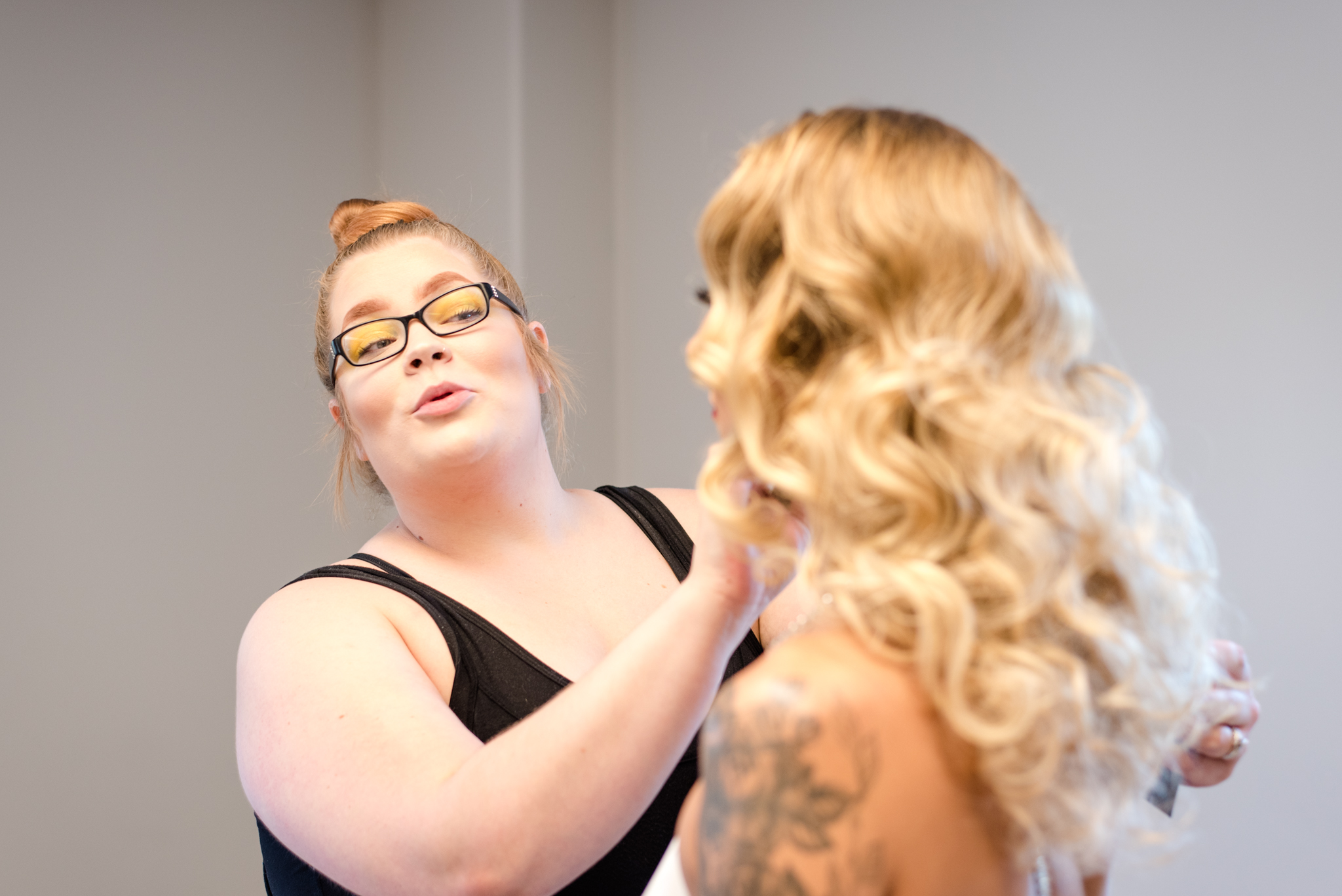 Makeup Artist, Hannah George, applies bridal makeup to a bride.